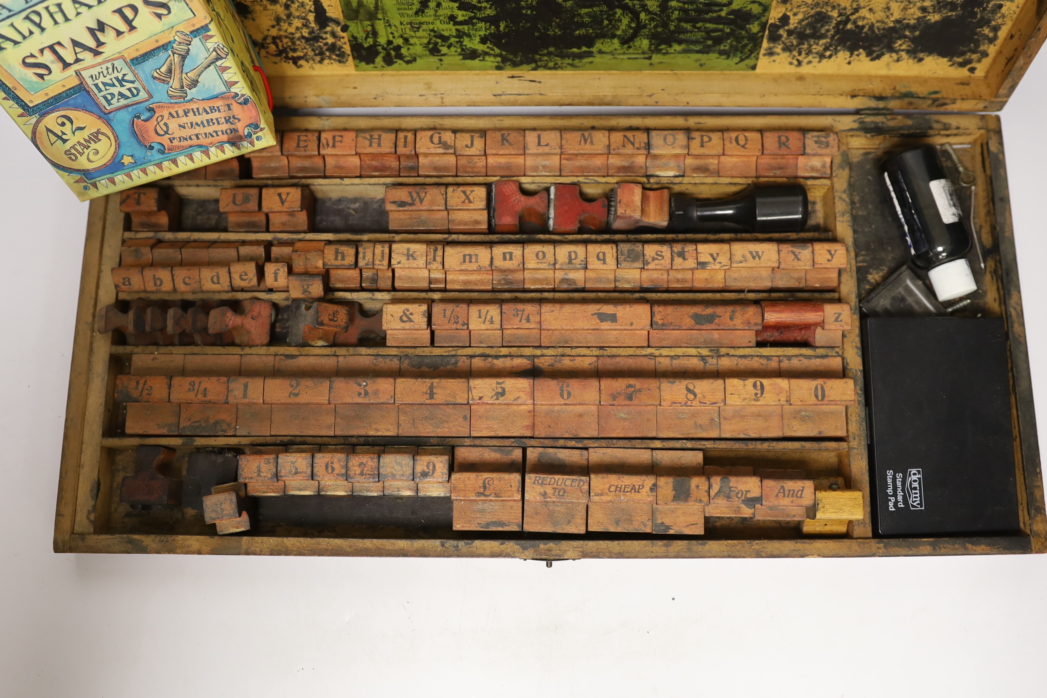A printer's block set and alphabet stamps, with ink